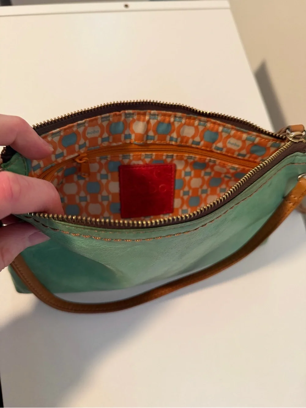 HOBO Green Leather Clutch with Brown Strap & Tassel.